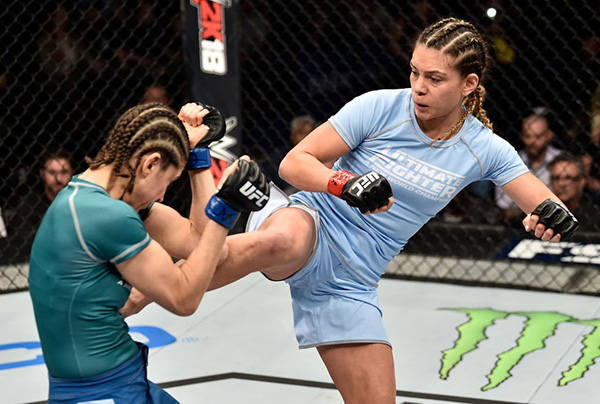 (R-L) <a href='../fighter/Nicco-Montano'>Nicco Montano</a> kicks <a href='../fighter/Roxanne-Modafferi'>Roxanne Modafferi</a> in their women's flyweight championship bout during the TUF Finale event inside Park Theater on December 01, 2017 in Las Vegas, Nevada. (Photo by Jeff Bottari/Zuffa LLC)