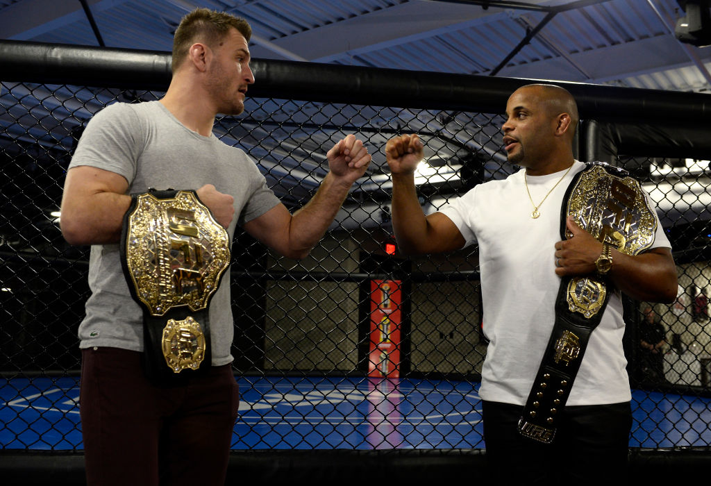 Stipe Miocic and Daniel Cormier bump fists during TUF: Undefeated media day on Feb. 2, 2018 (Photo by Brandon Magnus/Zuffa LLC)