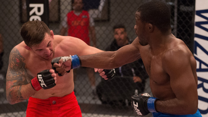 Fernando Acougueiro punches Nazareno Malagarie during the semi-finals for filming of The Ultimate Fighter Brazil: Team Nogueira vs Team Rua on March 7, 2015 in Las Vegas, Nevada. (Photo by Brandon Magnus/Zuffa LLC)