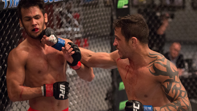 Reginaldo Viera punches Bruno Korea in the Octagon during the semi-finals for filming of The Ultimate Fighter Brazil: Team Nogueira vs Team Rua on March 7, 2015 in Las Vegas, Nevada. (Photo by Brandon Magnus/Zuffa LLC)