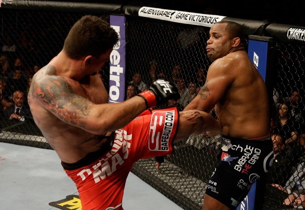 Mir kicks Cormier during their heavyweight bout Mir kicks Cormier during their heavyweight bout