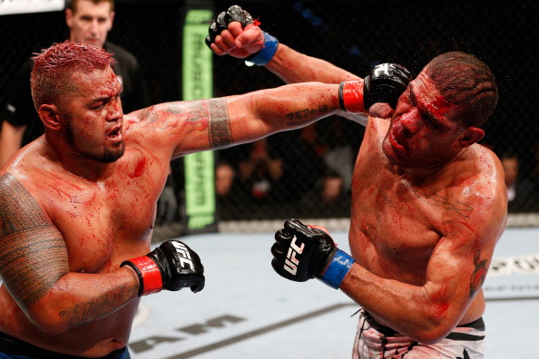 BRISBANE, AUSTRALIA - DECEMBER 07: (L-R) Mark Hunt punches Antonio