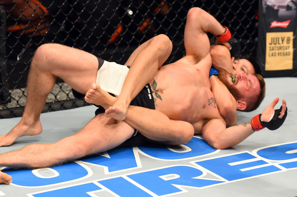 AUCKLAND, NEW ZEALAND - JUNE 11: (R-L) Ben Nguyen attempts to submit Tim Elliott in their flyweight fight during the UFC Fight Night event at the Spark Arena on June 11, 2017 in Auckland, New Zealand. (Photo by Josh Hedges/Zuffa LLC)