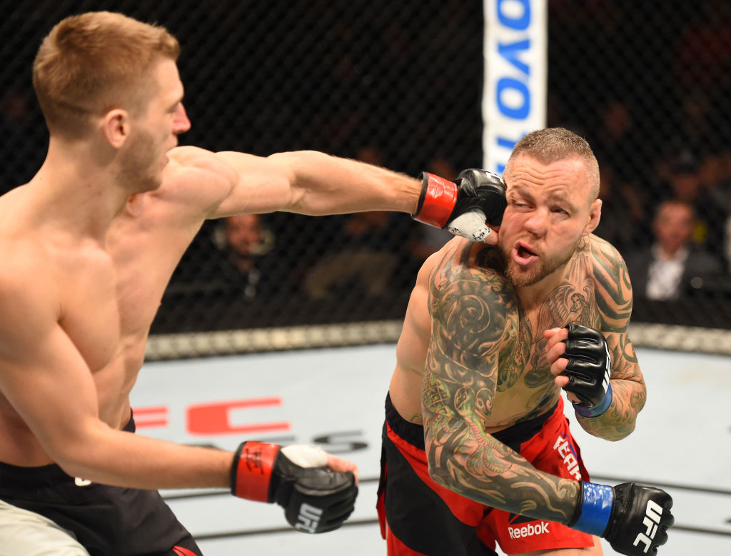 AUCKLAND, NEW ZEALAND - JUNE 11: (L-R) Dan Hooker of New Zealand punches Ross Pearson of England in their lightweight fight during the UFC Fight Night event at the Spark Arena on June 11, 2017 in Auckland, New Zealand. (Photo by Josh Hedges/Zuffa LLC)