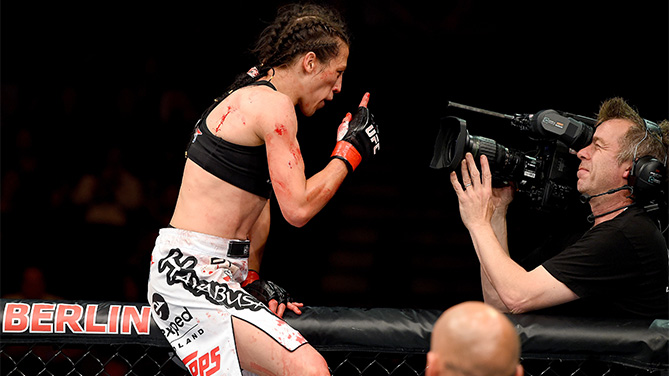 Joanna Jedrzejczyk of Poland celebrates after defeating Jessica Penne of the United States in their women's strawweight championship bout during the UFC Fight Night event at the O2 World on June 20, 2015 in Berlin, Germany. (Photo by Josh Hedges/Zuffa LLC)