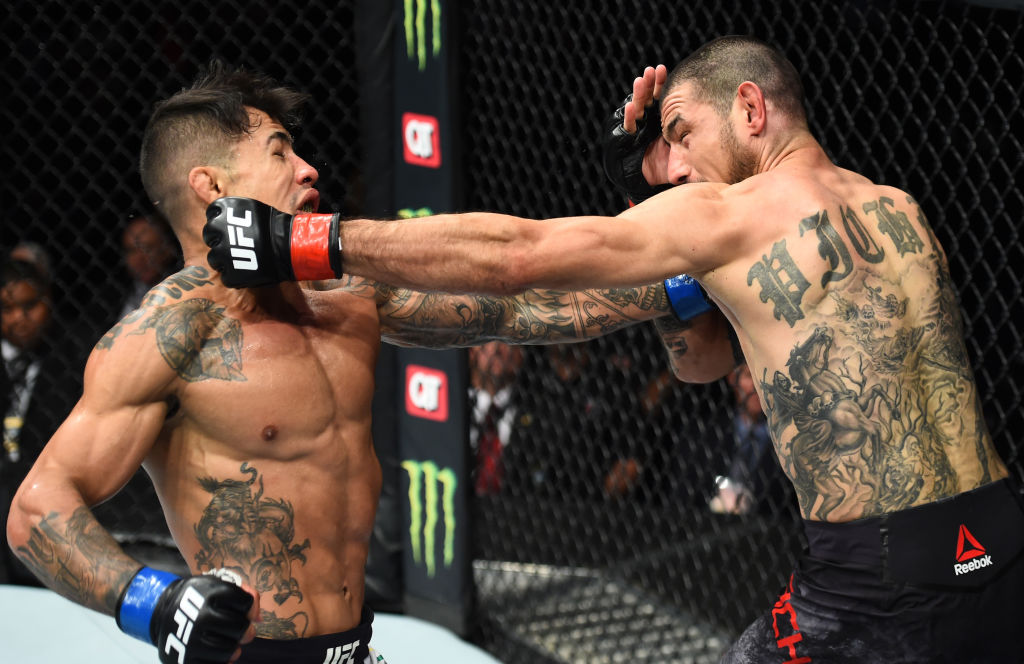 CHARLOTTE, NC - JANUARY 27: (R-L) Vinc Pichel punches Joaquim Silva of Brazil in their lightweight bout during a UFC Fight Night event at Spectrum Center on January 27, 2018 in Charlotte, North Carolina. (Photo by Josh Hedges/Zuffa LLC)