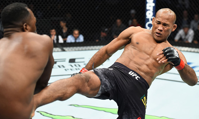 CHARLOTTE, NC - JANUARY 27: (R-L) <a href='../fighter/Ronaldo-Souza'>Ronaldo Souza</a> of Brazil kicks <a href='../fighter/Derek-Brunson'>Derek Brunson</a> in their middleweight bout during a <a href='../event/UFC-Silva-vs-Irvin'>UFC Fight Night </a>event at Spectrum Center on January 27, 2018 in Charlotte, North Carolina. (Photo by Josh Hedges/Zuffa LLC via Getty Images)
