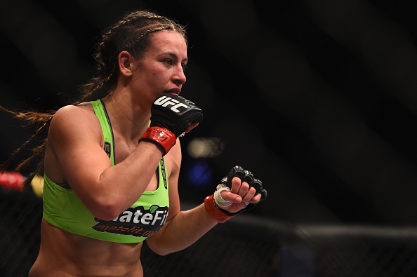 Miesha Tate stands in front of Sara McMann in their bout during UFC 183 on 1/31/15 in Las Vegas, NV. (Photo by Jeff Bottari/Zuffa LLC)