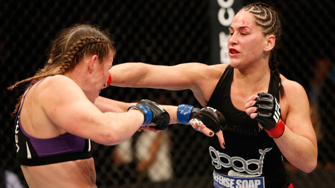 Jessica Eye punches Leslie Smith in their women's bantamweight fight during the UFC 180 event at the Arena Ciudad de Mexico on November 15, 2014 in Mexico City, Mexico. (Photo by Josh Hedges/Zuffa LLC)