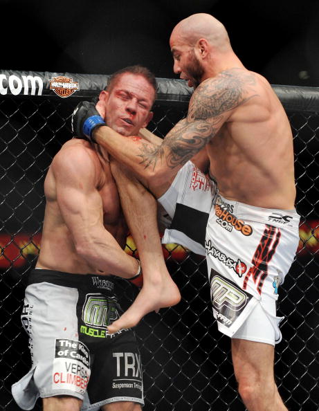 UFC fighter Ben Saunders (R) battles UFC fighter Marcus Davis (L) during their Welterweight Fight at UFC 106 in Las Vegas, Nevada. (Photo by Jon Kopaloff)