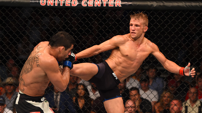 TJ Dillashaw kicks Renan Barao of Brazil in their UFC bantamweight championship bout during the UFC event at the United Center on July 25, 2015 in Chicago, Illinois. (Photo by Jeff Bottari/Zuffa LLC)