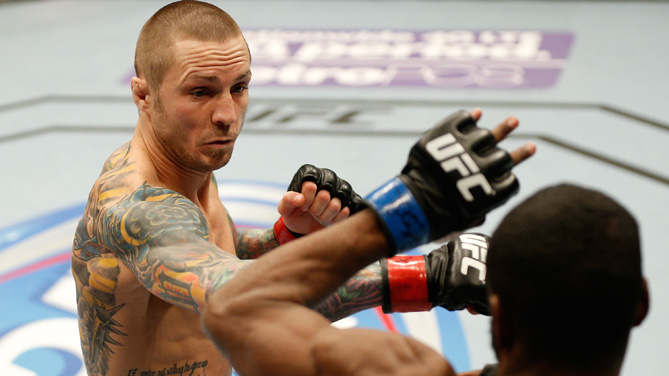 Eddie Wineland punches <a href='../fighter/Yves-Jabouin'>Yves Jabouin</a> during their bantamweight fight at the FOX UFC Saturday event at the United Center on January 25, 2014 in Chicago, Illinois. (Photo by Josh Hedges/Zuffa LLC)