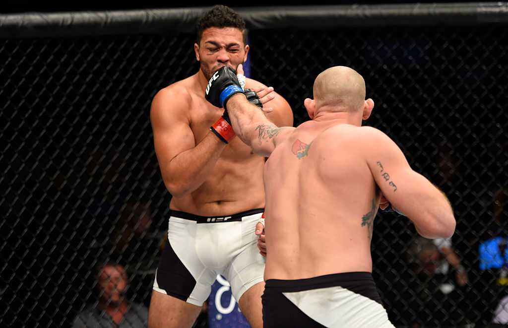 DENVER, CO - JANUARY 28: (R-L) Jordan Johnson punches Henrique da Silva of Brazil in their light heavyweight bout during the UFC Fight Night event at the Pepsi Center on January 28, 2017 in Denver, Colorado. (Photo by Josh Hedges/Zuffa LLC)