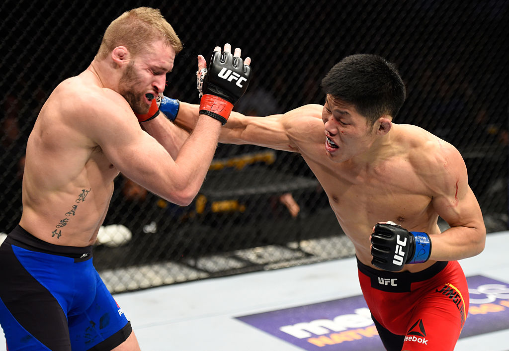 DENVER, CO - JANUARY 28: (R-L) Li Jingliang of China punches Li Jingliang of China in their welterweight bout during the UFC Fight Night event at the Pepsi Center on January 28, 2017 in Denver, Colorado. (Photo by Josh Hedges/Zuffa LLC)