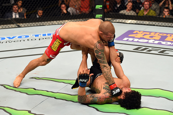 FAIRFAX, VA - APRIL 04: (L-R) Dustin Poirier punches Diego Ferreira in their lightweight fight during the UFC Fight Night event at the Patriot Center on April 4, 2015 in Fairfax, Virginia. (Photo by Josh Hedges/Zuffa LLC/Zuffa LLC via Getty Images)