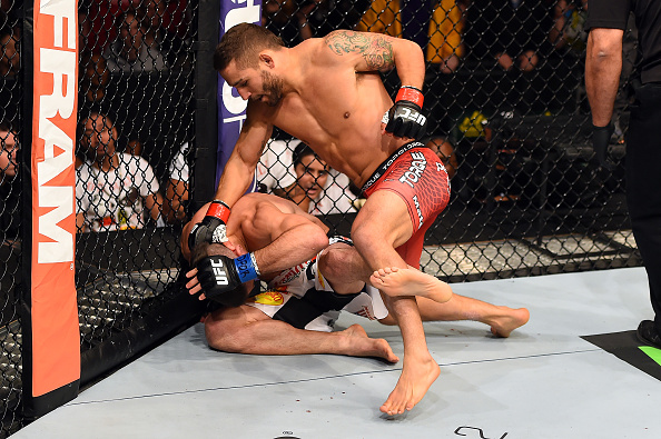 FAIRFAX, VA - APRIL 04: (R-L) Chad Mendes punches Ricardo Lamas in their featherweight fight. (Photo by Josh Hedges/Zuffa LLC)