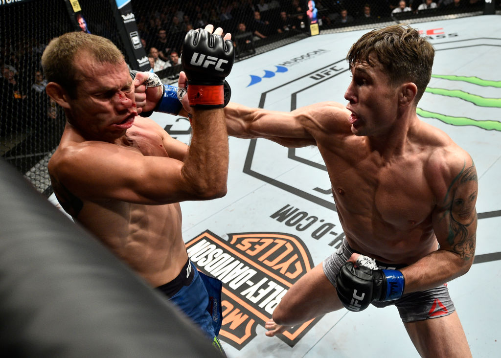 GDANSK, POLAND - OCTOBER 21: (R-L) Darren Till of England punches Donald Cerrone in their welterweight bout during the UFC Fight Night event inside Ergo Arena on October 21, 2017 in Gdansk, Poland. (Photo by Jeff Bottari/Zuffa LLC)