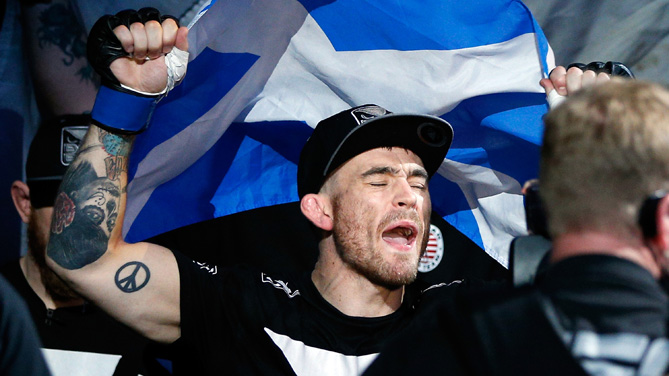 Robert Whiteford enters the arena before his featherweight bout against Daniel Pineda at UFC 171 inside American Airlines Center on March 15, 2014 in Dallas, Texas. (Photo by Josh Hedges/Zuffa LLC)
