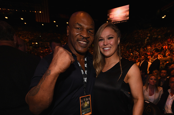 LAS VEGAS, NV - MAY 23: (L-R) Former world champion boxer Mike Tyson and UFC women's bantamweight champion Ronda Rousey in attendance during the UFC 187 event at the MGM Grand Garden Arena on May 23, 2015 in Las Vegas, Nevada. (Photo by Jeff Bottari/Zuffa LLC/Zuffa LLC via Getty Images)