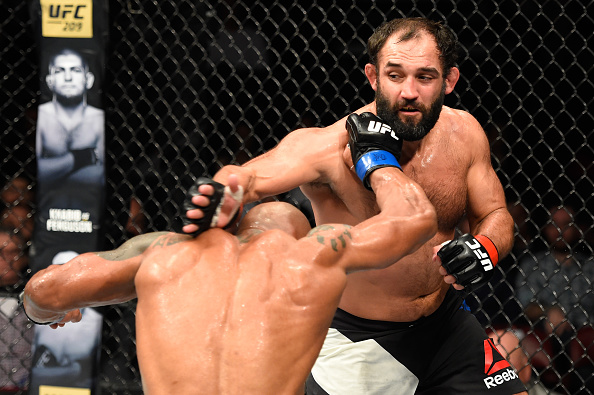 <a href='../fighter/Johny-Hendricks'>Johny Hendricks</a> punches <a href='../fighter/Hector-Lombard'>Hector Lombard</a> during his 185-pound debut victory in Halifax