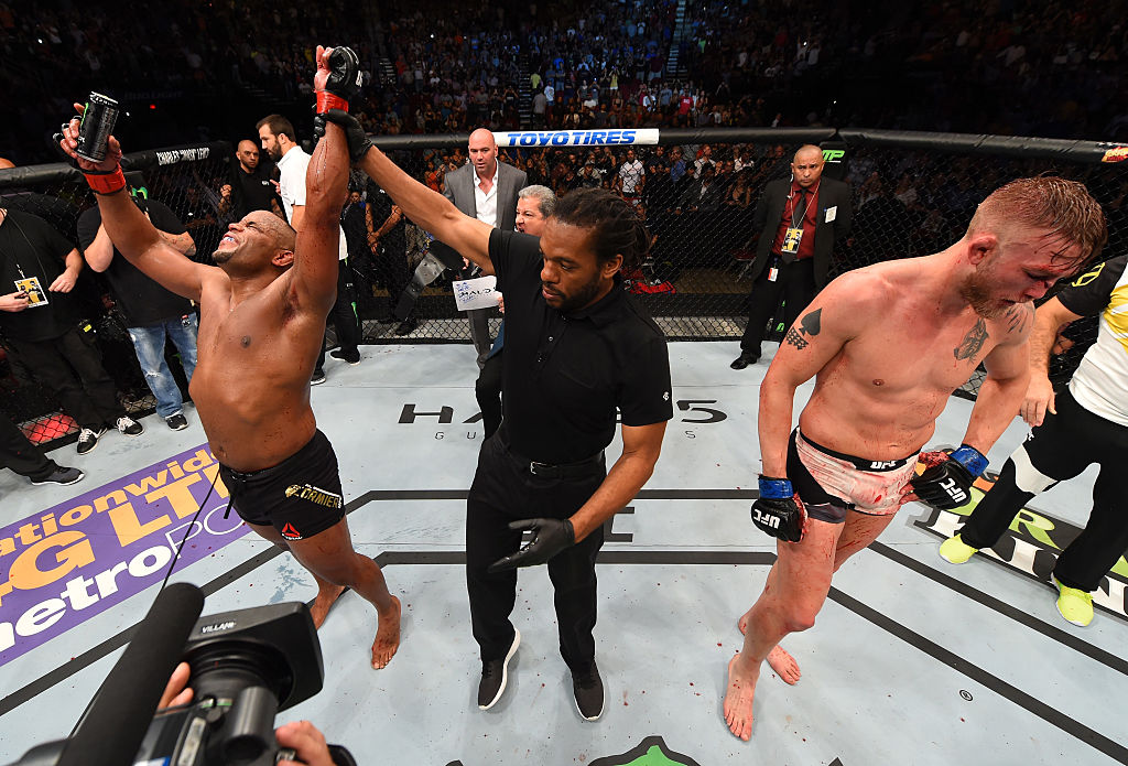 HOUSTON, TX - OCT. 03: (L-R) Daniel Cormier celebrates his victory over Alexander Gustafsson in their UFC light heavyweight championship bout during the UFC 192 event at the Toyota Center. (Photo by Josh Hedges/Zuffa LLC)