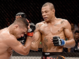 Alex Oliveira of Brazil punches Gilbert Durinho of Brazil in their lightweight bout during the UFC Fight Night at Maracanazinho Gymnasium on March 21, 2015 in Rio de Janeiro, Brazil. (Photo by Buda Mendes/Zuffa LLC)