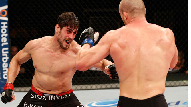 Antonio Carlos Junior of Brazil punches Patrick Cummins of the United States in their light heavyweight fight during the UFC Fight Night event inside the Ginasio Jose Correa on December 20, 2014 in Barueri, Brazil. (Photo by Josh Hedges/Zuffa LLC)