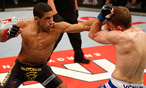 (L-R) Hacran Dias punches <a href='../fighter/Nik-Lentz'>Nik Lentz</a> in their featherweight bout during the UFC on FX event on May 18, 2013 at Arena Jaragua in Jaragua do Sul, Santa Catarina, Brazil. (Photo by Josh Hedges/Zuffa LLC)