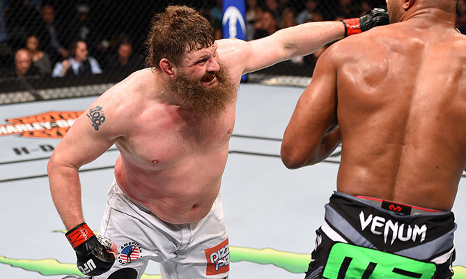 DALLAS, TX - MARCH 14: (L-R) Roy Nelson punches Alistair Overeem in their heavyweight bout during the UFC 185 event at the American Airlines Center. (Photo by Josh Hedges/Zuffa LLC)