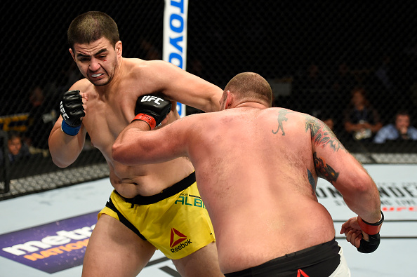 UNIONDALE, NY - JULY 22: (L-R) Junior Albini punches Timothy Johnson in their heavyweight bout during the UFC Fight Night event inside the Nassau Veterans Memorial Coliseum on July 22, 2017 in Uniondale, New York. (Photo by Josh Hedges/Zuffa LLC/Zuffa LLC via Getty Images)