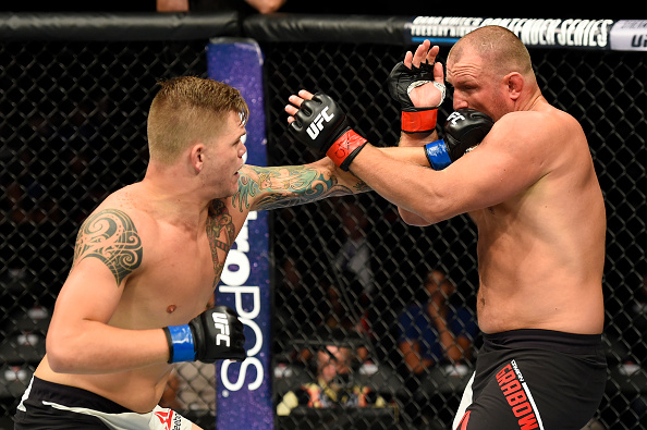 UNIONDALE, NY - JULY 22: (L-R) Chase Sherman punches Damian Grabowski of Poland in their heavyweight bout during the UFC Fight Night event inside the Nassau Veterans Memorial Coliseum on July 22, 2017 in Uniondale, New York. (Photo by Josh Hedges/Zuffa LLC/Zuffa LLC via Getty Images)
