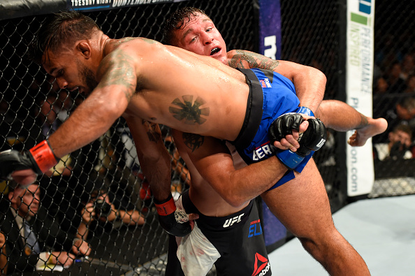 UNIONDALE, NY - JULY 22: (R-L) Darren Elkins attempts to take down Dennis Bermudez in their featherweight bout during the UFC Fight Night event inside the Nassau Veterans Memorial Coliseum on July 22, 2017 in Uniondale, New York. (Photo by Josh Hedges/Zuffa LLC/Zuffa LLC via Getty Images)