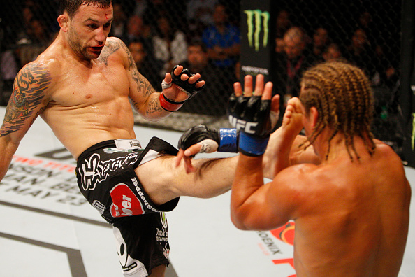 MANILA, PHILIPPINES - MAY 16: Frankie Edgar of the United States throws a kick at Uriah Faber of the United States in their featherweight fight during the UFC Fight Night event at the Mall of Asia Arena on May 16, 2015 in Manila, Philippines. (Photo by Mitch Viquez/Zuffa LLC/Zuffa LLC via Getty Images)