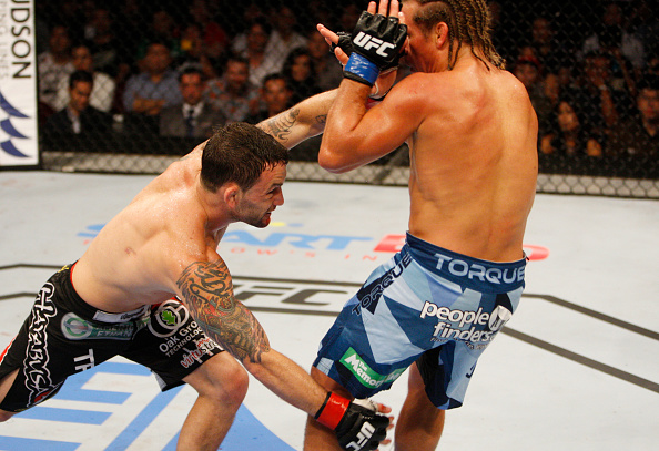 MANILA, PHILIPPINES - MAY 16: Frankie Edgar of the United States takes down Uriah Faber of the United States in their featherweight fight during the UFC Fight Night event at the Mall of Asia Arena on May 16, 2015 in Manila, Philippines. (Photo by Mitch Viquez/Zuffa LLC/Zuffa LLC via Getty Images)