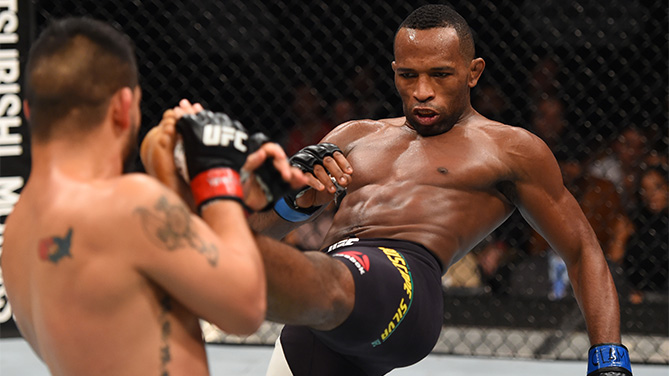 (R-L) Leandro Silva of Brazil kicks Efrain Escudero of Mexico in their lightweight bout during the UFC Fight Night event at Arena Monterrey on November 21, 2015 in Monterrey, Mexico. (Photo by Jeff Bottari/Zuffa LLC)