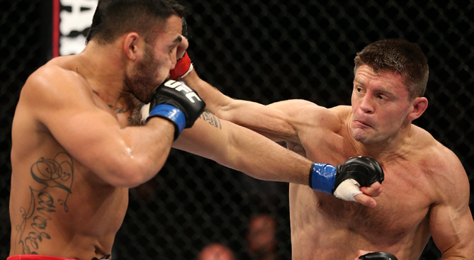 Tom Watson punches Brad Tavares during their middleweight fight at the UFC on Fuel TV event at Capital FM Arena on September 29, 2012 in Nottingham, England. (Photo by Josh Hedges/Zuffa LLC/Zuffa LLC via Getty Images)