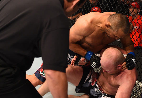 NEW ORLEANS, LA - JUNE 06: Dan Henderson punches Tim Boetsch in their middleweight bout during the UFC event at the Smoothie King Center. (Photo by Josh Hedges/Zuffa LLC/Zuffa LLC)