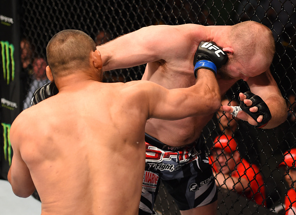 NEW ORLEANS, LA - JUNE 06: (L-R) Dan Henderson punches Tim Boetsch in their middleweight bout during the UFC event at the Smoothie King Center. (Photo by Josh Hedges/Zuffa LLC/Zuffa LLC)