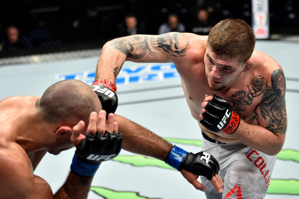 Jake Collier punches Marcel Fortuna of Brazil in their light heavyweight bout during the UFC Fight Night event inside the Ted Constant Convention Center on November 11, 2017 in Norfolk, Virginia. (Photo by Brandon Magnus/Zuffa LLC)