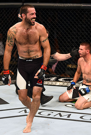 Matt Brown (left) reacts to his victory over <a href='../fighter/Tim-Means'>Tim Means</a> in their welterweight fight during the UFC 189 event inside MGM Grand Garden Arena on July 11, 2015 in Las Vegas, Nevada. (Photo by Josh Hedges/Zuffa LLC)