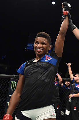 Angela Hill celebrates after her unanimous-decision victory over <a href='../fighter/ashley-yoder'>Ashley Yoder</a> in their women's strawweight bout during <a href='../event/The-Ultimate-Fighter-T-Rampage-vs-T-Forrest-Finale'><a href='../event/The-Ultimate-Fighter-Finale-Team-Nog-vs-Team-Mir'><a href='../event/The-Ultimate-Fighter-Team-Liddell-vs-Team-Ortiz-FINALE'><a href='../event/TUF13-finale'><a href='../event/the-ultimate-fighter-a-champion-will-be-crowned'>The Ultimate Fighter Finale </a></a></a></a></a>at T-Mobile Arena on July 7, 2017 in Las Vegas, Nevada. (Photo by Brandon Magnus/Zuffa LLC)