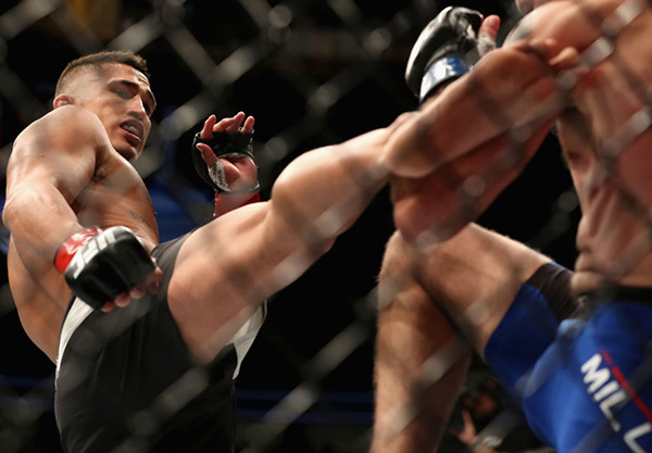 <a href='../fighter/Anthony-Pettis'>Anthony Pettis</a> kicks <a href='../fighter/Jim-Miller'>Jim Miller</a> in their lightweight bout during the UFC 213 event at T-Mobile Arena on July 8, 2017 in Las Vegas, Nevada. (Photo by Christian Petersen/Zuffa LLC)