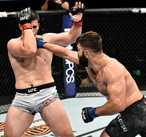 <a href='../fighter/Andrei-Arlovski'>Andrei Arlovski</a> of Belarus punches <a href='../fighter/Junior-Albini'>Junior Albini</a> of Brazil in their heavyweight bout during the UFC Fight Night event inside the Ted Constant Convention Center on November 11, 2017 in Norfolk, Virginia. (Photo by Brandon Magnus/Zuffa LLC)