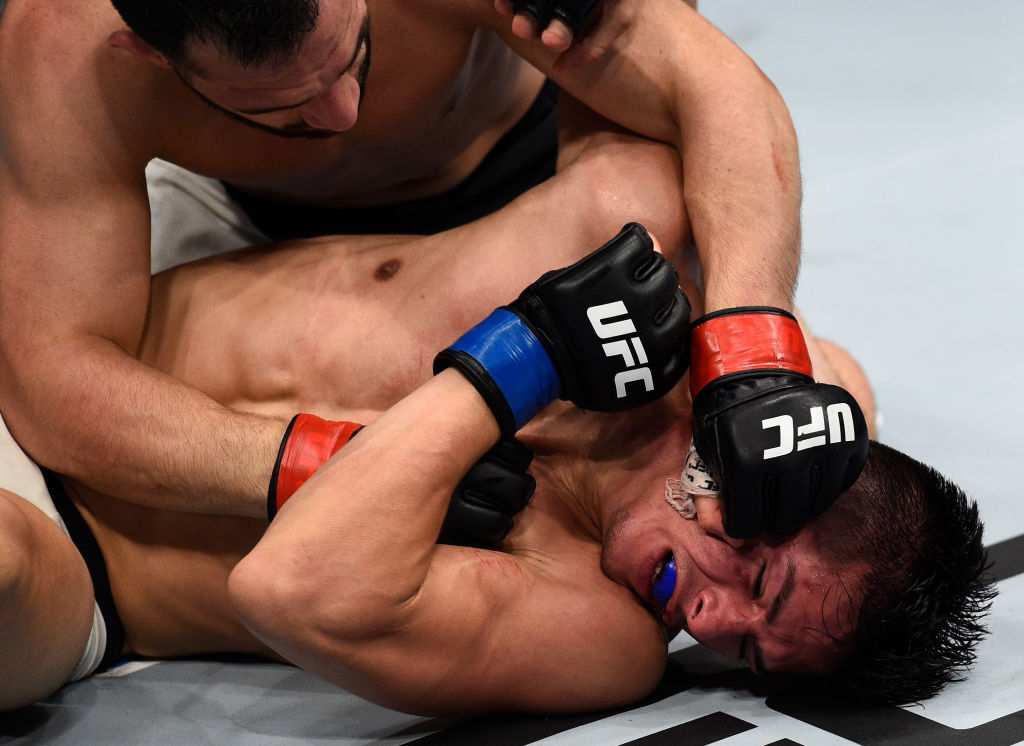 OKLAHOMA CITY, OK - JUNE 25: (L-R) Jared Gordon punches Michel Quinones in their featherweight bout during the UFC Fight Night event at the Chesapeake Energy Arena on June 25, 2017 in Oklahoma City, Oklahoma. (Photo by Brandon Magnus/Zuffa LLC)