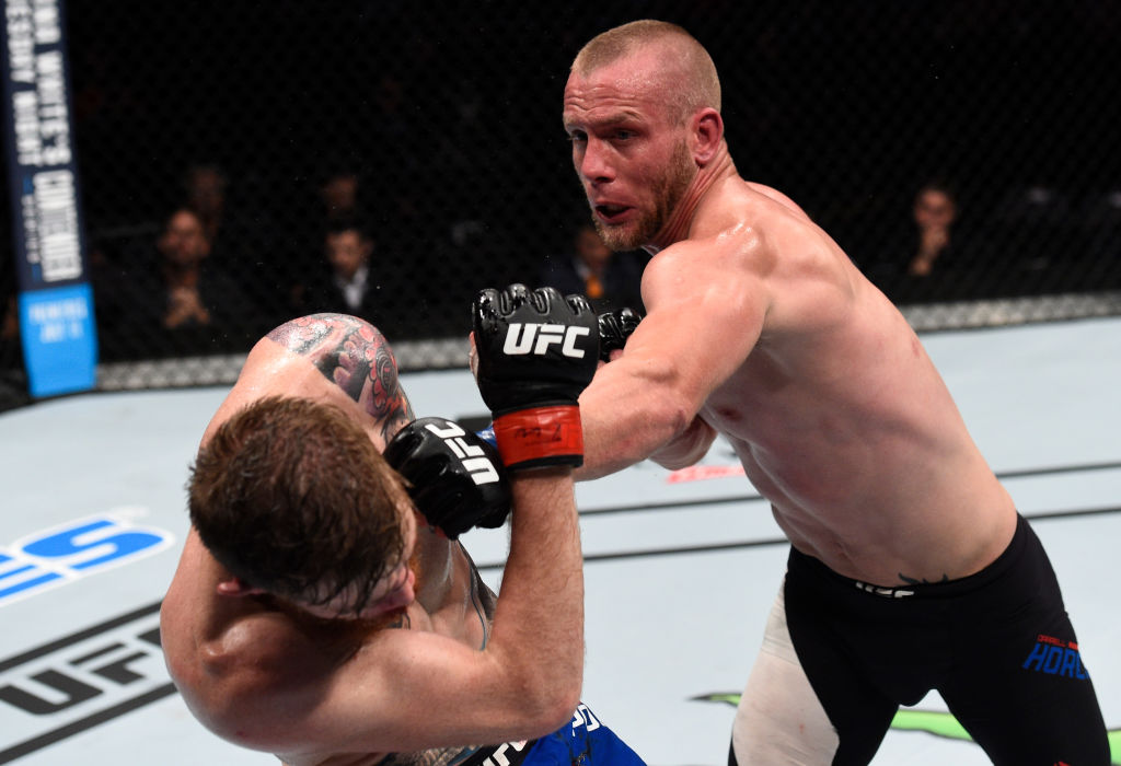 OKLAHOMA CITY, OK - JUNE 25: (R-L) Darrell Horcher punches Devin Powell in their lightweight bout during the UFC Fight Night event at the Chesapeake Energy Arena on June 25, 2017 in Oklahoma City, Oklahoma. (Photo by Brandon Magnus/Zuffa LLC)