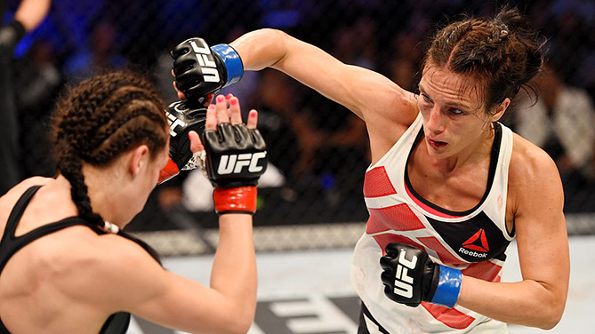 MELBOURNE, AUSTRALIA - NOVEMBER 15: Valerie Letourneau (R) throws a right-handed punch against Joanna Jedrzejczyk (L) in their UFC women's strawweight championship bout during the UFC 193 event at Etihad Stadium on November 15, 2015 in Melbourne, Australia. (Photo by Josh Hedges/Zuffa LLC)