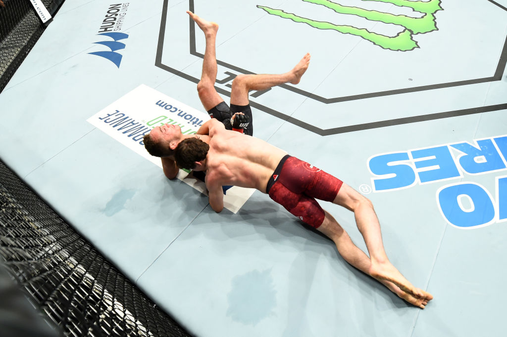 PITTSBURGH, PA - SEPTEMBER 16: (R-L) Olivier Aubin-Mercier of Canada takes down Tony Martin in their lightweight bout during the UFC Fight Night event inside the PPG Paints Arena on September 16, 2017 in Pittsburgh, Pennsylvania. (Photo by Josh Hedges/Zuffa LLC)