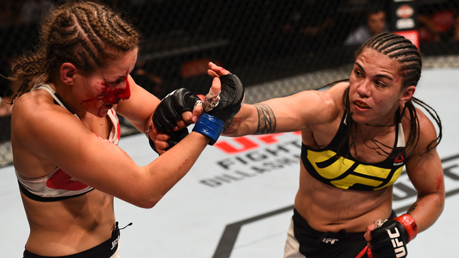 Jessica Andrade of Brazil punches Sarah Moras of Canada in their women's bantamweight bout during the UFC event at the Valley View Casino Center on July 15, 2015 in San Diego, California. (Photo by Jeff Bottari/Zuffa LLC)