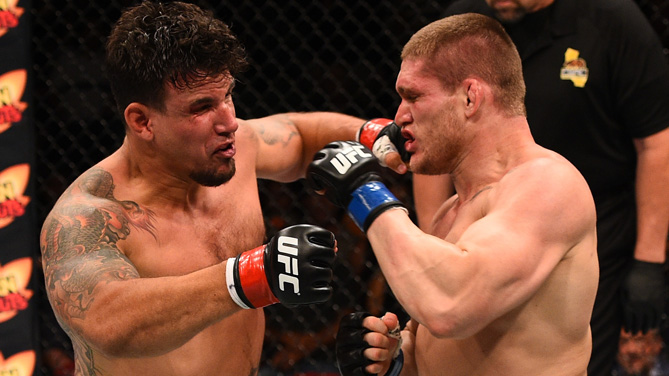 <a href='../fighter/Frank-Mir'>Frank Mir</a> punches <a href='../fighter/Todd-Duffee'>Todd Duffee</a> in their heavyweight bout during the UFC event at the Valley View Casino Center on July 15, 2015 in San Diego, California. (Photo by Jeff Bottari/Zuffa LLC)