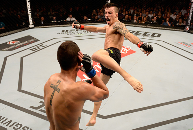 Thomas Almeida of Brazil kicks Anthony Birchak of the United States in their bantamweight bout during the UFC Fight Night Belfort v Henderson at Ibirapuera Gymnasium on November 7, 2015 in Sao Paulo, Brazil. (Photo by Buda Mendes/Zuffa LLC)